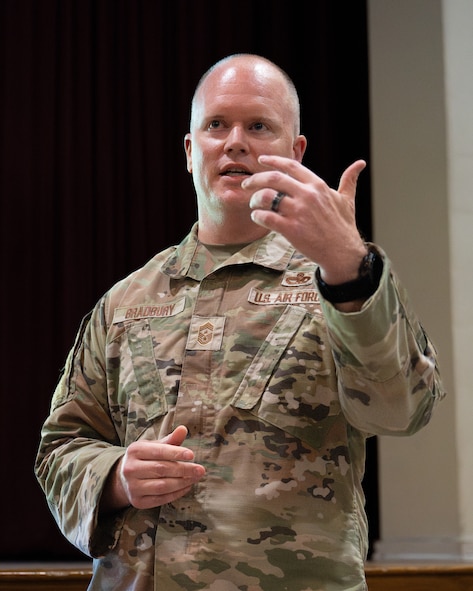 U.S. Air Force Chief Master Sergeant Scott D. Bradbury, 5th Bomb Wing Command Chief, addresses Airmen at an all-call July 23, 2026, at Minot Air Force Base, North Dakota. As the senior enlisted leader for the wing, Bradbury serves as Burrell’s principal advisor on matters affecting readiness, professional development, discipline, welfare and force utilization. (U.S. Air Force photo by Senior Airman Kendra A. Ransum)