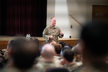 U.S. Air Force Chief Master Sergeant Scott D. Bradbury, 5th Bomb Wing Command Chief, addresses Airmen at an all-call July 23, 2026, at Minot Air Force Base, North Dakota. All-calls, or Commanders' calls, are held to bring members of the unit together to communicate priorities, recognize outstanding performance and provide a forum for Airmen to ask questions directly to leadership.