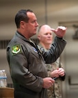 U.S. Air Force Col. John E. Burrell, 5th Bomb Wing commander, addresses Airmen an all-call July 23, 2026, at Minot Air Force Base, North Dakota. The commander's call is intended to gather the entire unit to discuss important concerns. (U.S. Air Force photo by Senior Airman Kendra A. Ransum)