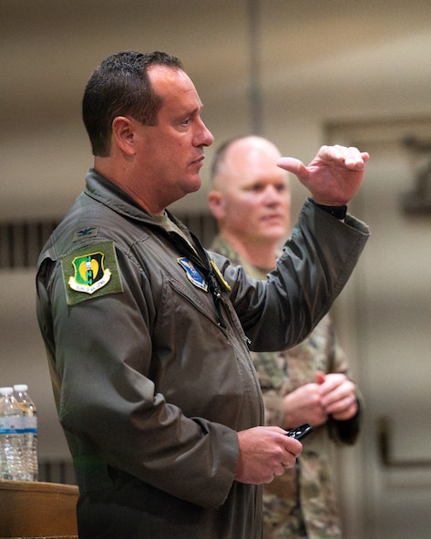 U.S. Air Force Col. John E. Burrell, 5th Bomb Wing commander, addresses Airmen an all-call July 23, 2026, at Minot Air Force Base, North Dakota. The commander's call is intended to gather the entire unit to discuss important concerns. (U.S. Air Force photo by Senior Airman Kendra A. Ransum)