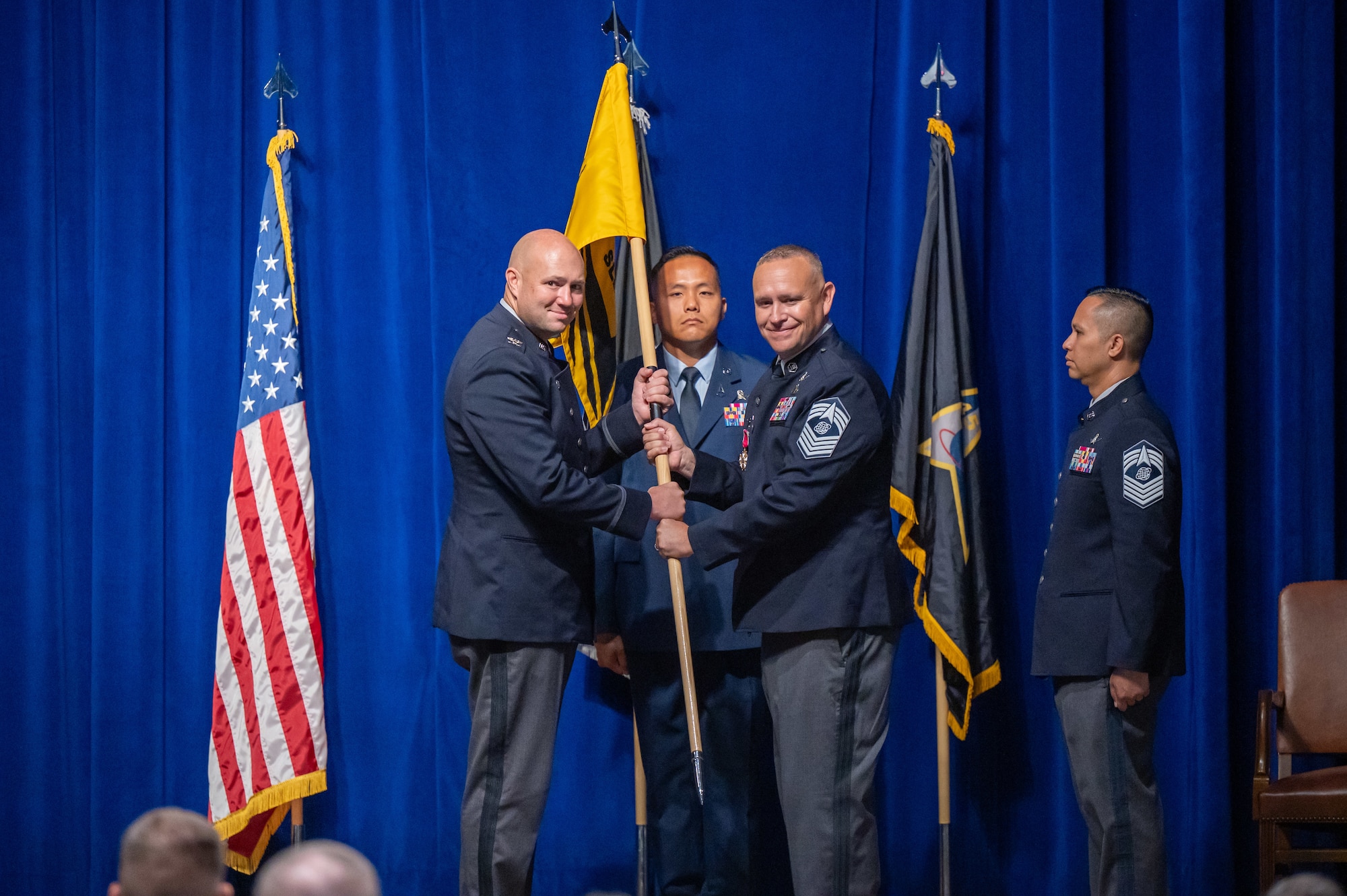 Military members conduct a change of responsibility ceremony