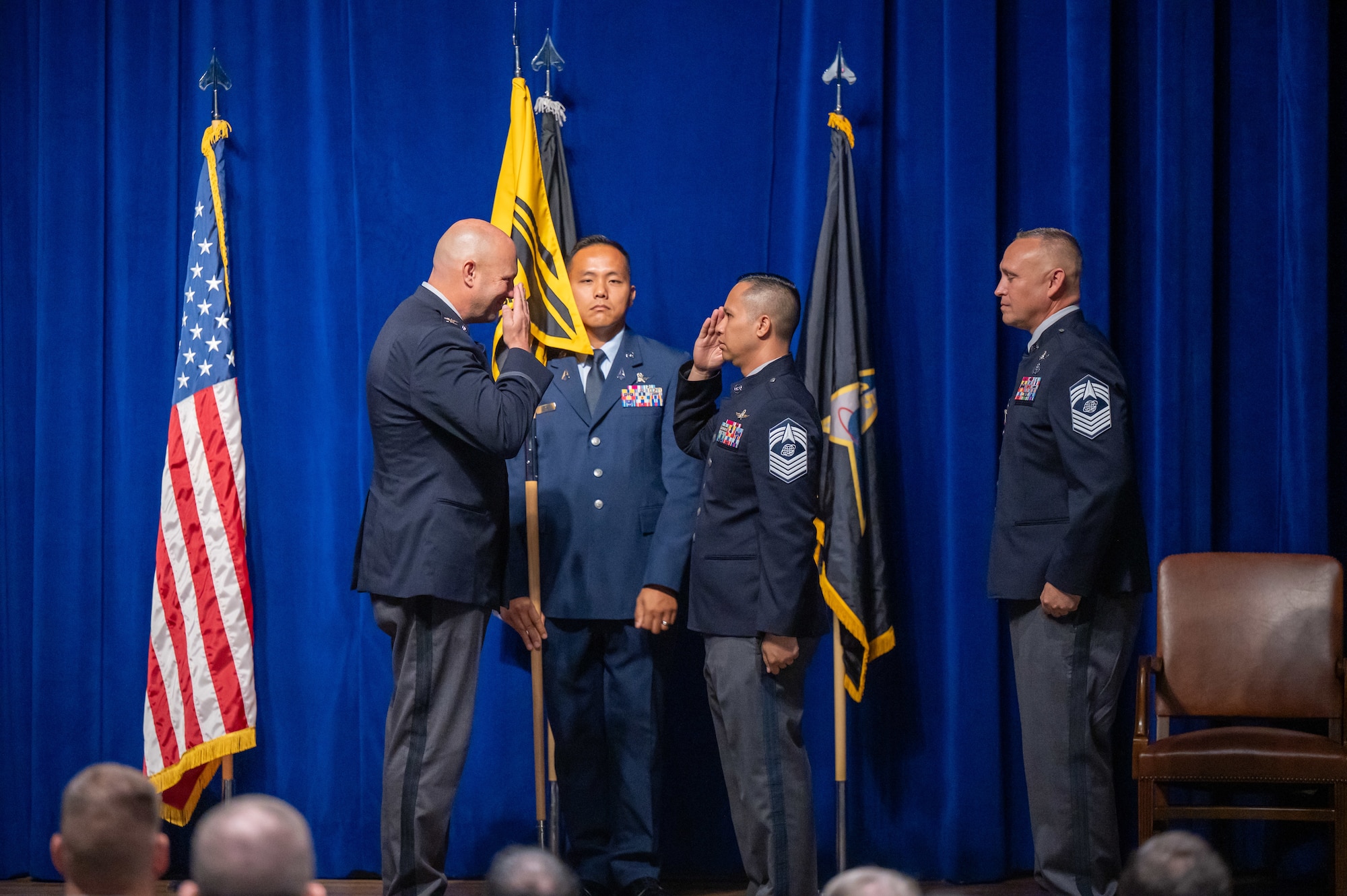 Military members conduct a change of responsibility ceremony