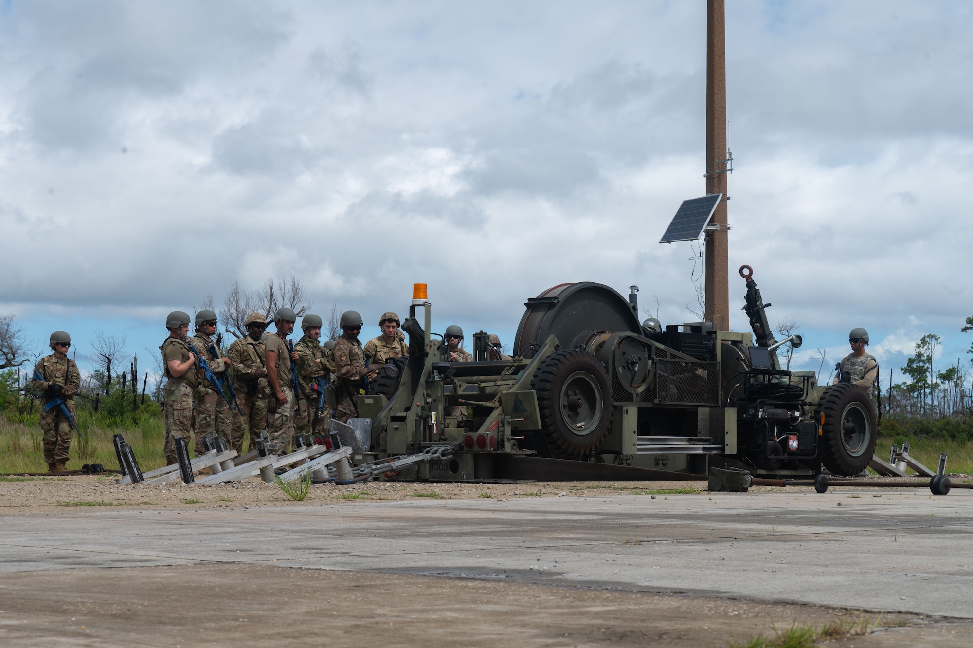 U.S. Air Force Airmen assigned to the 355th Combat Air Base Squadron learn about the Mobile Aircraft Arresting System during Exercise Coyote Storm 26.1 at Tyndall Air Force Base, Florida, July 20, 2026. During the exercise, Airmen built on previous experience by working in cross-functional teams organized according to specialty and mission requirements. (U.S. Air Force photo by Airman 1st Class Jaden Kidd)