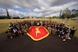 Soldiers from the 25th Infantry Division and players from the University of Hawaii football team pose for a group photo at Weyand Field on Schofield Barracks, Hawaii, July 24, 2026.