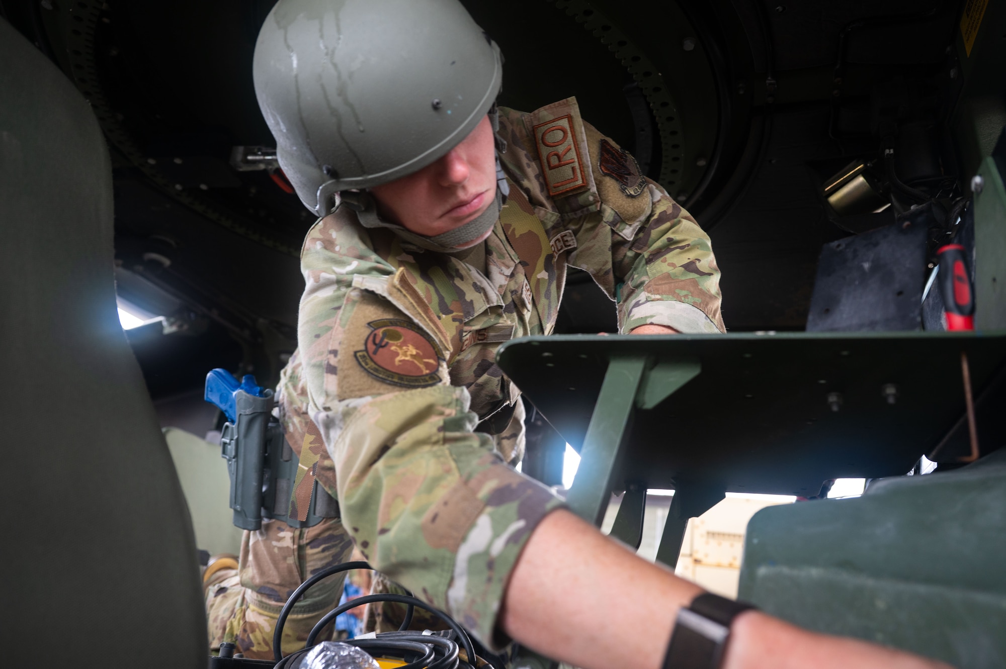 A U.S. Air Force Airman assigned to the 355th Combat Air Base Squadron participates in vehicle search training during Exercise Coyote Storm 26.1 at Tyndall Air Force Base, Florida, July 20, 2026. The exercise provided Airmen hands-on experience responding to high-intensity scenarios in deployed environments. (U.S. Air Force photo by Airman 1st Class Jaden Kidd)