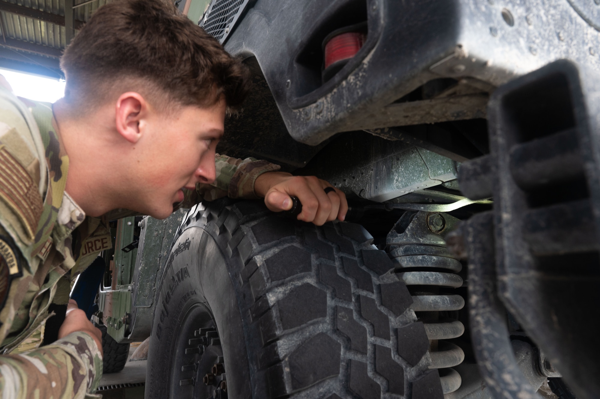 A U.S. Air Force Airman assigned to the 355th Combat Air Base Squadron participates in vehicle search training during Exercise Coyote Storm 26.1 at Tyndall Air Force Base, Florida, July 20, 2026. CS 26.1 gave Airmen hands-on experience in expeditionary operations, from base construction to emergency response. (U.S. Air Force photo by Airman 1st Class Jaden Kidd)
