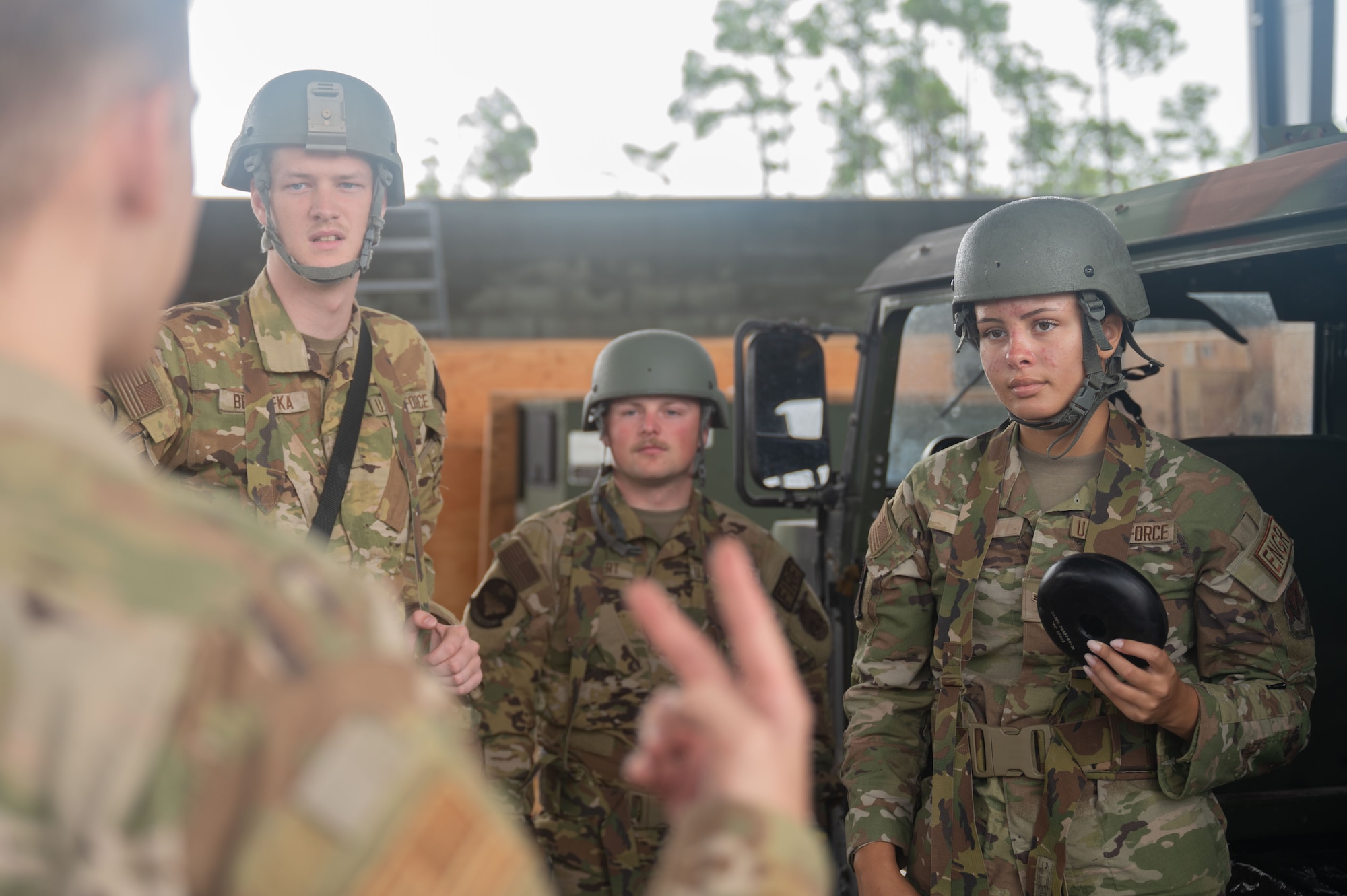 U.S. Air Force Airmen assigned to the 355th Security Forces Squadron, explain vehicle search and recovery fundamentals during Exercise Coyote Storm 26.1 at Tyndall Air Force Base, Florida, July 20, 2026. CS 26.1 strengthened unit cohesion by integrating Airmen from multiple units into cross-functional teams prepared to meet mission requirements. (U.S. Air Force photo by Airman 1st Class Jaden Kidd)