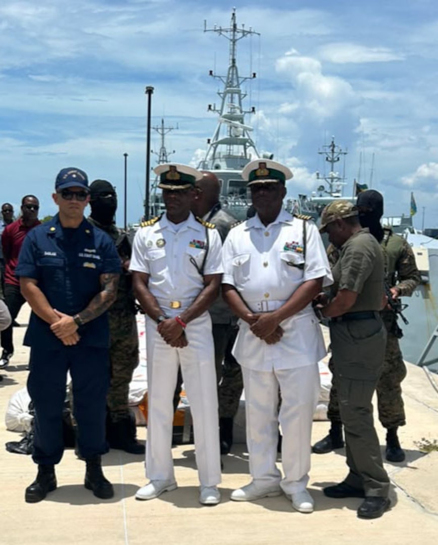 The Coast Guard liaison officer to the U.S. Embassy in The Bahamas poses for a photo with members of the Royal Bahamian Defense Force during a drug offload at Coral Harbour, The Bahamas, July 27, 2026. The offload was the result of Coast Guard Cutter Charles Sexton interdicting a suspected drug-smuggling vessel in coordination with the Royal Bahamian Defense Force crews, seizing approximately 2,380 pounds of presumptive marijuana worth an estimate of $2.8 million. (U.S. Coast Guard photo)
