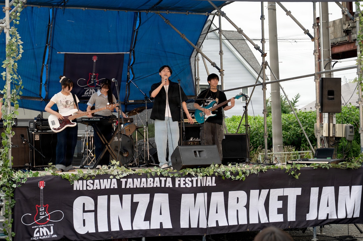 A band plays on stage during a festival in Japan