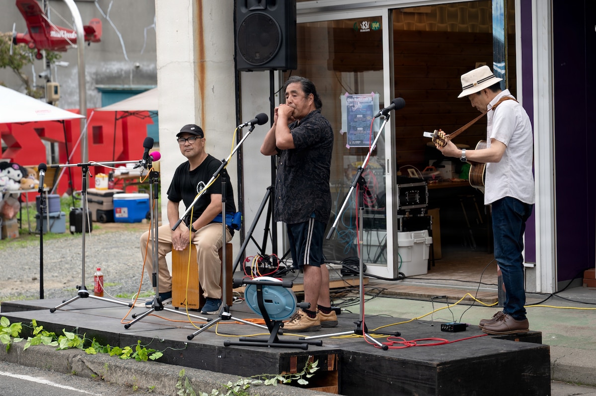 A band performs on the street during a festival