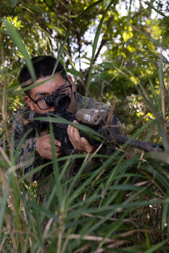 U.S. Marine Corps Pfc. Angel R. Avalos, a combat graphics specialist with Marine Corps Installations Pacific, poses for a photo during a Communication Strategy and Operations field training exercise on Camp Hansen, Okinawa, Japan, April 8, 2026. The COMMSTRAT FTX is a five-day event focused on increasing quick decision-making skills and tactical proficiency through high pressure environments to provide commanders with more capable COMMSTRAT forces. (U.S. Marine Corps photo by Cpl. Ella Cadby)