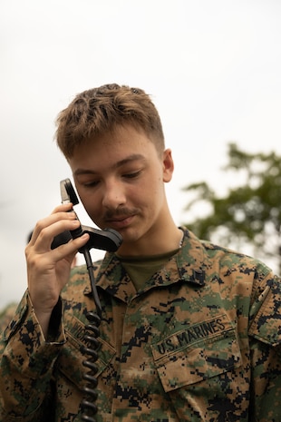 U.S. Marine Corps Pfc. Ryan Wicinski, a data systems administrator with Marine Rotational Force – Southeast Asia, I Marine Expeditionary Force, operates a radio while conducting a high frequency radio shot to Marine Rotational Force – Darwin, I MEF, on Camp General Emilio Aguinaldo, Philippines, July 23, 2026.