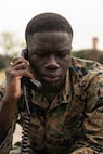 U.S. Marine Corps Cpl. Limamou Diene, a data systems administrator with Marine Rotational Force – Southeast Asia, I Marine Expeditionary Force, operates a radio while conducting a high frequency radio shot to Marine Rotational Force – Darwin, I MEF, on Camp General Emilio Aguinaldo, Philippines, July 23, 2026.