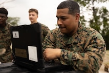 U.S. Marine Corps Gunnery Sgt. Douglas Perez, a New York native and transmissions chief with Marine Rotational Force – Southeast Asia, I Marine Expeditionary Force, operates a ruggedized laptop while conducting a high frequency radio shot to Marine Rotational Force – Darwin, I MEF, on Camp General Emilio Aguinaldo, Philippines, July 23, 2026.