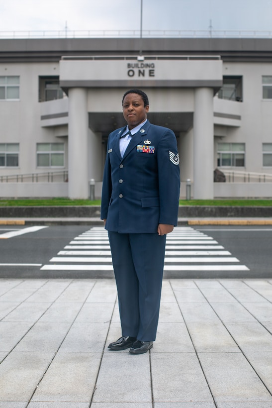U.S. Air Force Tech. Sgt. Janiqua Robinson, a public affairs craftsman with Stars and Stripes, War Media Activity, Marine Corps Air Station Iwakuni, and a native of Clinton, Maryland, poses for a photo at Marine Corps Air Station Iwakuni, Japan, May 8, 2026. Robinson researches and produces multimedia products that incorporate various major commands throughout the Indo-Pacific to help communicate messages to both the public and Department of War leadership. (U.S. Marine Corps photo by Lance Cpl. Kenneth Garcia)