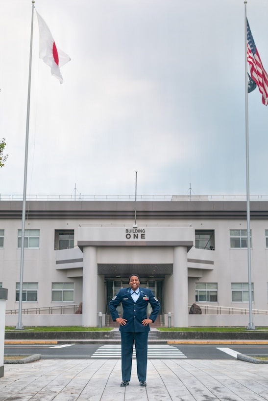 U.S. Air Force Tech. Sgt. Janiqua Robinson, a public affairs craftsman with Stars and Stripes, War Media Activity, Marine Corps Air Station Iwakuni, and a native of Clinton, Maryland, poses for a photo at Marine Corps Air Station Iwakuni, Japan, May 8, 2026. Robinson researches and produces multimedia products that incorporate various major commands throughout the Indo-Pacific to help communicate messages to both the public and Department of War leadership. (U.S. Marine Corps photo by Lance Cpl. Kenneth Garcia)