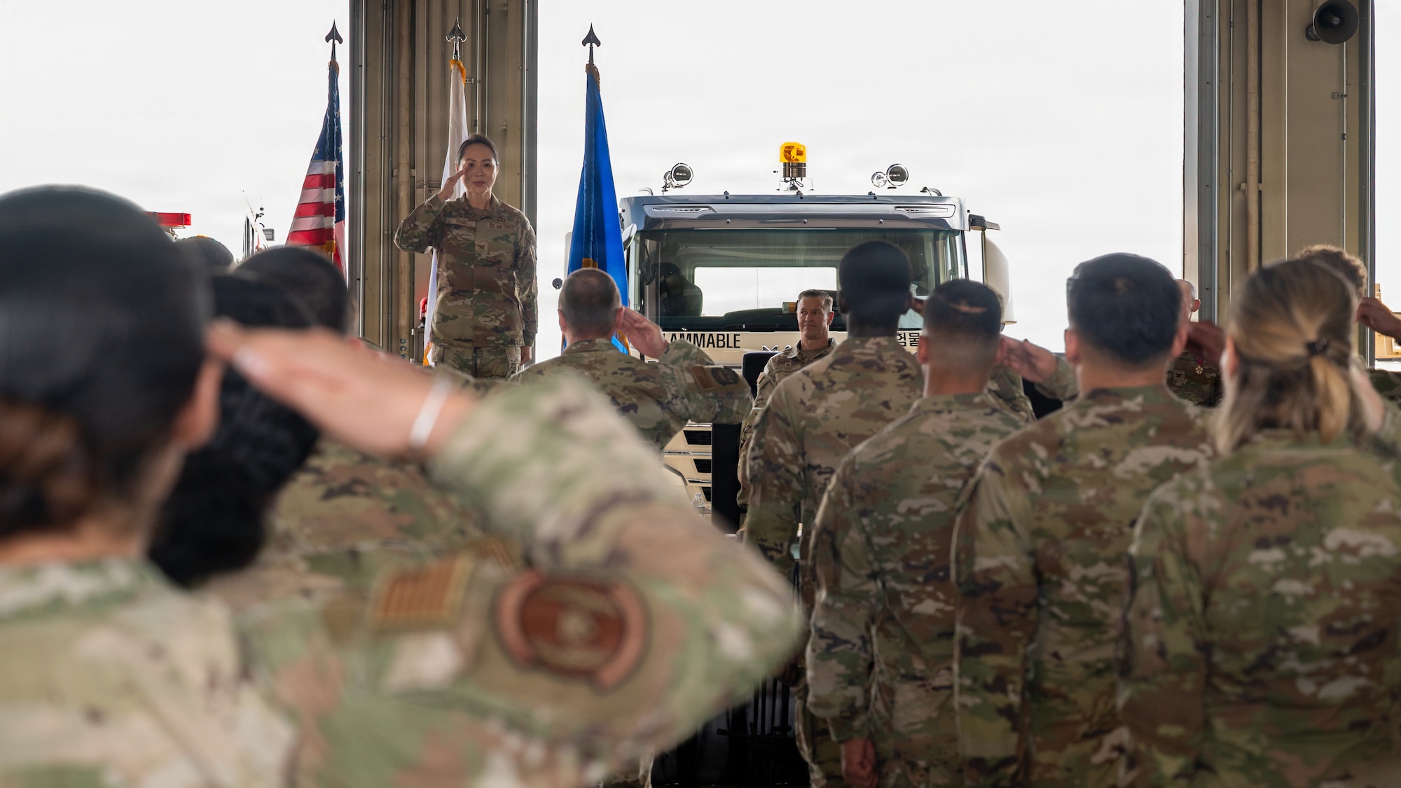 A flight salutes their commander