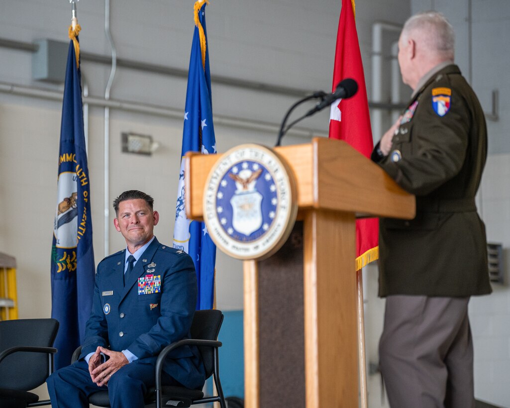 U.S. Army Maj. Gen. Haldane Lamberton, right, adjutant general of the Kentucky National Guard, speaks during a ceremony promoting U.S. Air Force Col. Ash Groves, left, to the rank of brigadier general at the Kentucky Air National Guard Base in Louisville, Ky., June 7, 2026. Groves is chief of the Air staff at Joint Force Headquarters-Kentucky. (U.S. Air National Guard photo by Senior Airman Annaliese Billings)