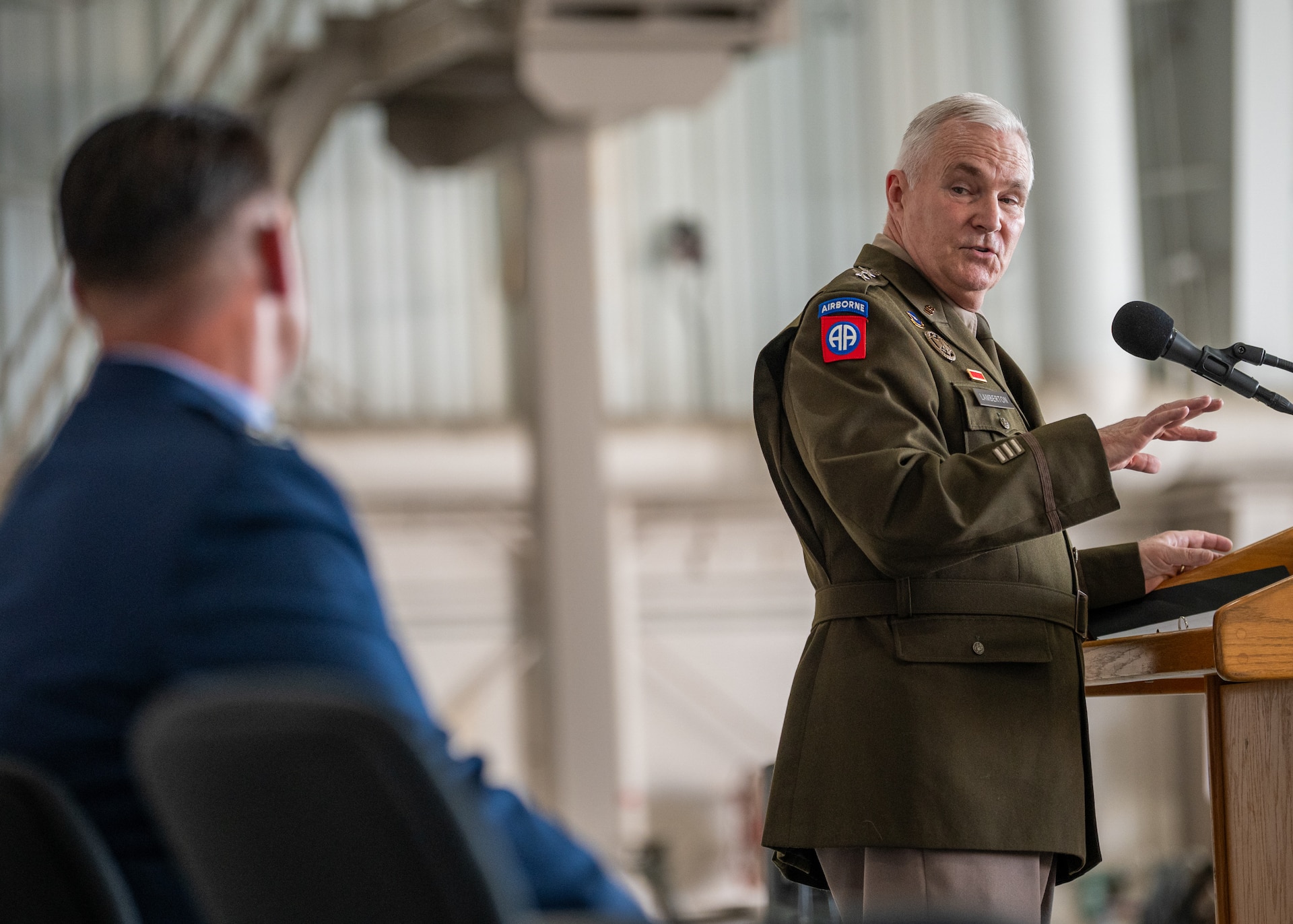 U.S. Army Maj. Gen. Haldane Lamberton, right, adjutant general of the Kentucky National Guard, speaks during a ceremony promoting U.S. Air Force Col. Ash Groves, left, to the rank of brigadier general at the Kentucky Air National Guard Base in Louisville, Ky., June 7, 2026. Groves is chief of the Air staff at Joint Force Headquarters-Kentucky. (U.S. Air National Guard photo by Senior Airman Annaliese Billings)