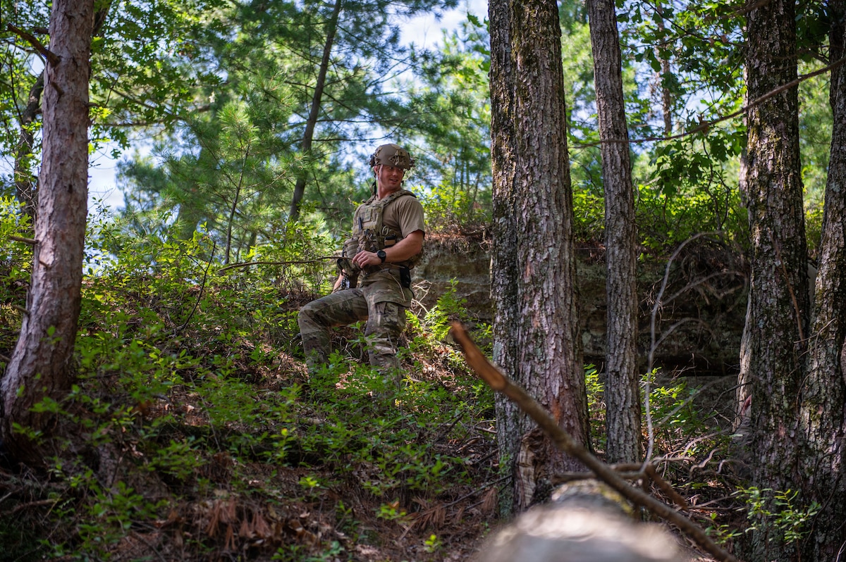 A U.S. Airman assigned to the 155th Air Refueling Wing, Nebraska Air National Guard, Lincoln, Nebraska conducts a simulated point of origin investigation during the fourteenth annual Audacious Warrior exercise, at Volk Field Air National Guard Base, Camp Douglas, Wisconsin, July 20, 2026. Audacious Warrior is an annual exercise designed to convene explosive ordnance disposal technicians from various backgrounds to train on the latest EOD scenarios, enhance operational readiness, and exchange knowledge and techniques. (U.S. Air National Guard photo by Senior Airman Jessica Duch)