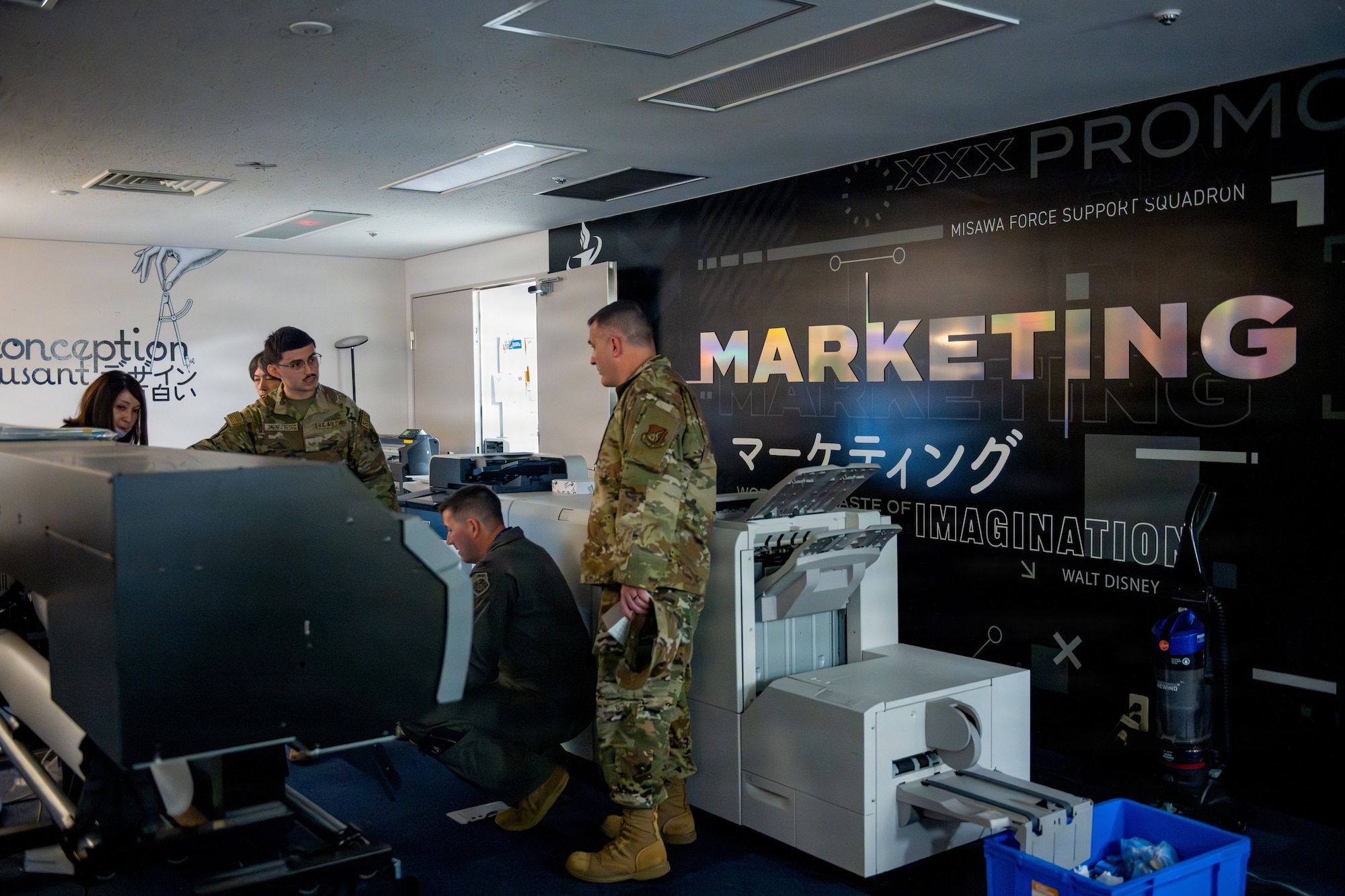 U.S. Air Force 35th Force Support Squadron marketing and publicity communications specialists showcase printing capabilities to 35th Fighter Wing leadership during a Wild Weasel Walk-Through.