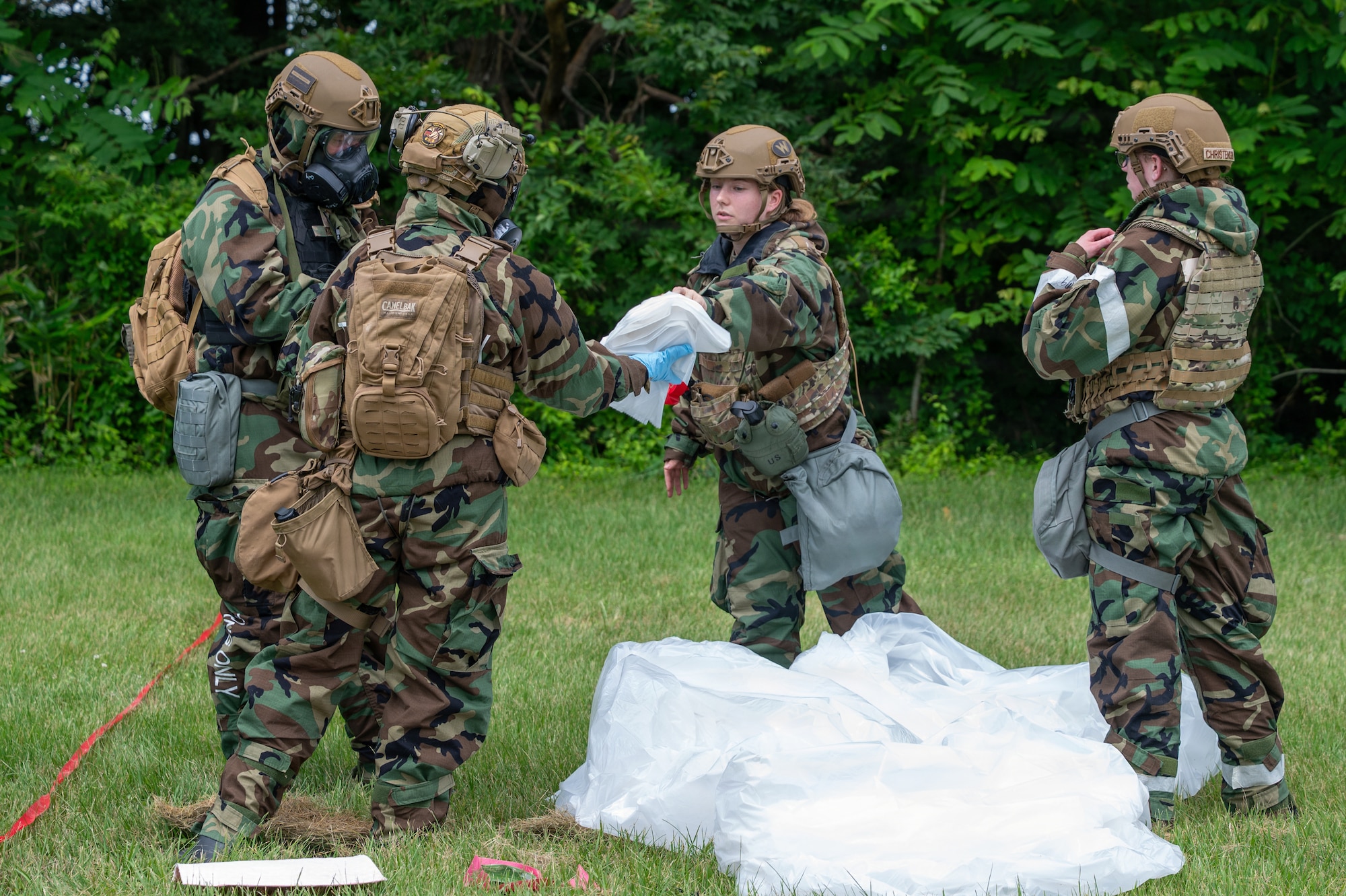 U.S. Air National Guard members prepare contamination control bags for the collection of contaminated gear during a chemical, biological, radiological and nuclear training scenario as part of Serow Samurai at Misawa Air Base, Japan, July 20, 2026.
