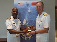 Commander, U.S. Naval Forces Europe and Africa Admiral George Wikoff took part in a cultural gift exchange with the Commander of the Cabo Verde Coast Guard, Capitao de Navio Kahbi Yassine Fonseca Pereira Batista during the African Maritime Forces Summit 2026.