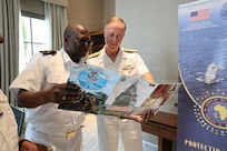Adm. George Wikoff, Commander, U.S. Naval Forces Europe and Africa, exchanges gifts with Adm. Valentim Alberto Antonio, Commander of the Angolan Navy, in Rabat, Morocco, July 21, 2026.