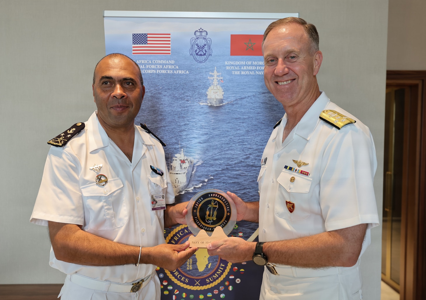 Adm. George Wikoff, Commander, U.S. Naval Forces Europe and Africa exchanges gifts with the Chief of Navy Staff, Madagascar Navy Rear Adm. Kalobe Mickael Sam Hieng Twion, during the African Maritime Forces Summit 2026 in Rabat, Morocco, July 21, 2026