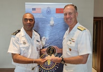Adm. George Wikoff, Commander, U.S. Naval Forces Europe and Africa exchanges gifts with the Chief of Navy Staff, Madagascar Navy Rear Adm. Kalobe Mickael Sam Hieng Twion, during the African Maritime Forces Summit 2026 in Rabat, Morocco, July 21, 2026