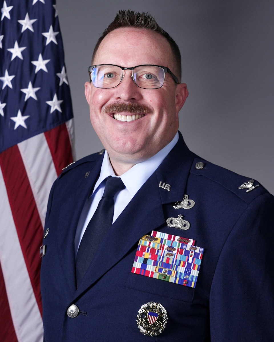 Military member poses for a photo