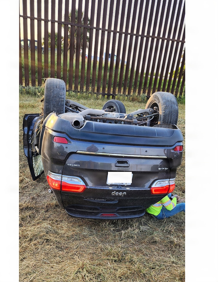 A civilian motorist leans on his damaged vehicle following a single-vehicle rollover accident in the Rio Grande Valley, Texas, July 9, 2026. U.S. Army Soldiers with the 252nd Engineer Company, assigned to the 130th Maneuver Enhancement Brigade, assigned to Joint Task Force-Southern Border in support of Operation Ardent Vanguard, discovered the accident while conducting a routine patrol and provided immediate assistance to the motorist until local authorities arrived.