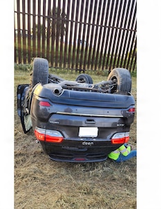 A civilian motorist leans on his damaged vehicle following a single-vehicle rollover accident in the Rio Grande Valley, Texas, July 9, 2026. U.S. Army Soldiers with the 252nd Engineer Company, assigned to the 130th Maneuver Enhancement Brigade, assigned to Joint Task Force-Southern Border in support of Operation Ardent Vanguard, discovered the accident while conducting a routine patrol and provided immediate assistance to the motorist until local authorities arrived.
