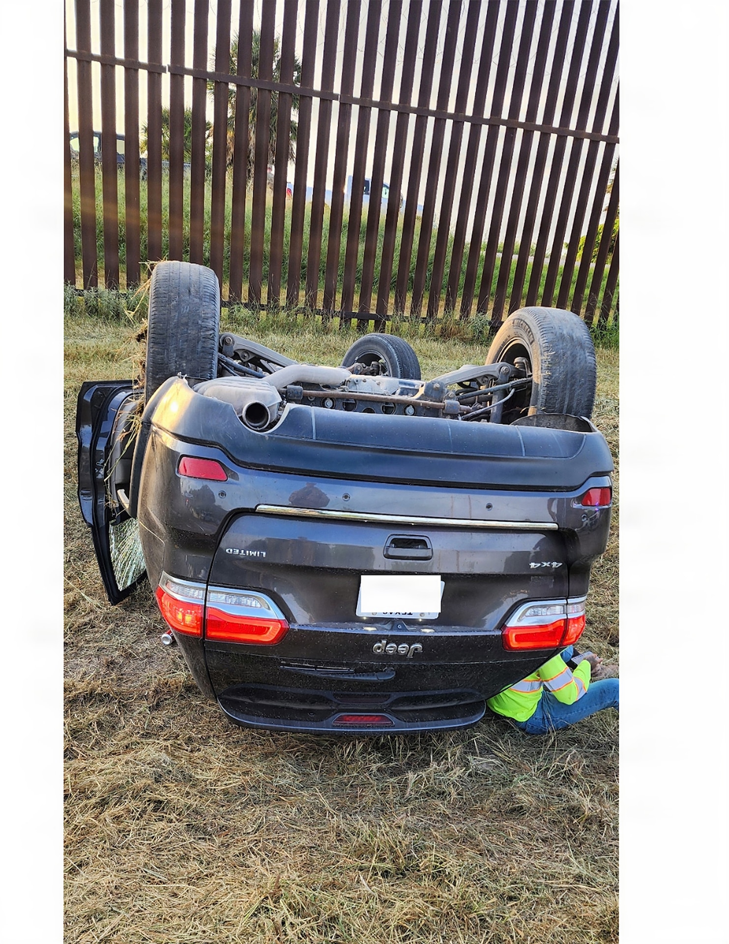 A civilian motorist leans on his damaged vehicle following a single-vehicle rollover accident in the Rio Grande Valley, Texas, July 9, 2026. U.S. Army Soldiers with the 252nd Engineer Company, assigned to the 130th Maneuver Enhancement Brigade, assigned to Joint Task Force-Southern Border in support of Operation Ardent Vanguard, discovered the accident while conducting a routine patrol and provided immediate assistance to the motorist until local authorities arrived.