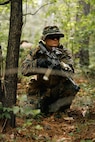 U.S. Marine Corps 2nd Lt. Samantha Hinerman, a student with Company C, The Basic School, provides security during a patrol base exercise at Marine Corps Base Quantico, Virginia, June 9, 2026. The exercise provides students with an opportunity to develop and refine skills in communication, patrolling and coordinating movements in a dense environment. (U.S. Marine Corps photo by Cpl. Joshua Barker)