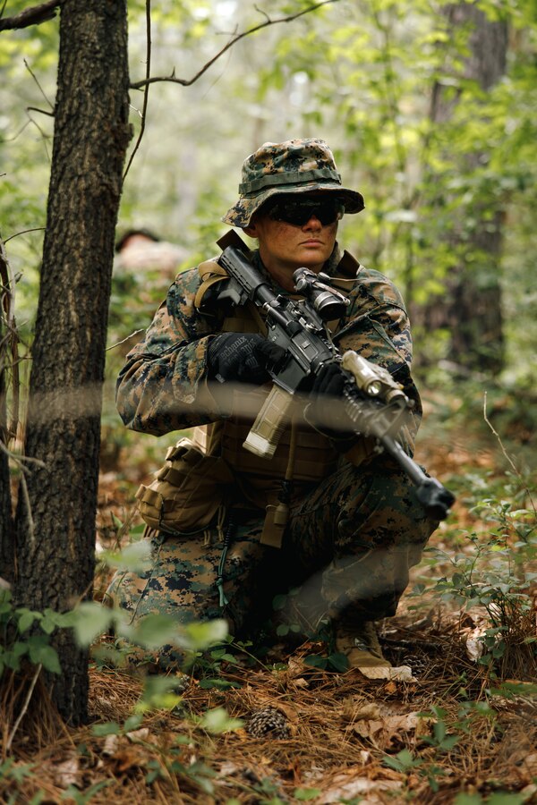 U.S. Marine Corps 2nd Lt. Samantha Hinerman, a student with Company C, The Basic School, provides security during a patrol base exercise at Marine Corps Base Quantico, Virginia, June 9, 2026. The exercise provides students with an opportunity to develop and refine skills in communication, patrolling and coordinating movements in a dense environment. (U.S. Marine Corps photo by Cpl. Joshua Barker)