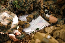 U.S. Marine Corps students with Company C, The Basic School, participate in a patrol base exercise at Marine Corps Base Quantico, Virginia, June 9, 2026. The exercise provides students with an opportunity to develop and refine skills in communication, patrolling and coordinating movements in a dense environment. (U.S. Marine Corps photo by Cpl. Joshua Barker)