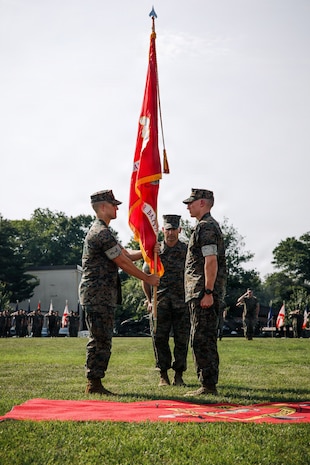 U.S. Marine Corps Lt. Col. Brian Hinrichs, the outgoing commanding officer of Combat Instructor Battalion, right, passes the colors to Lt. Col. Oryan Lopes, the incoming commanding officer of CIB during the CIB change of command ceremony at Marine Corps Base Quantico, Virginia, June 11, 2026. During the ceremony, Hinrichs relinquished command of CIB to Lopes. (U.S. Marine Corps photo by Cpl. Joshua Barker)