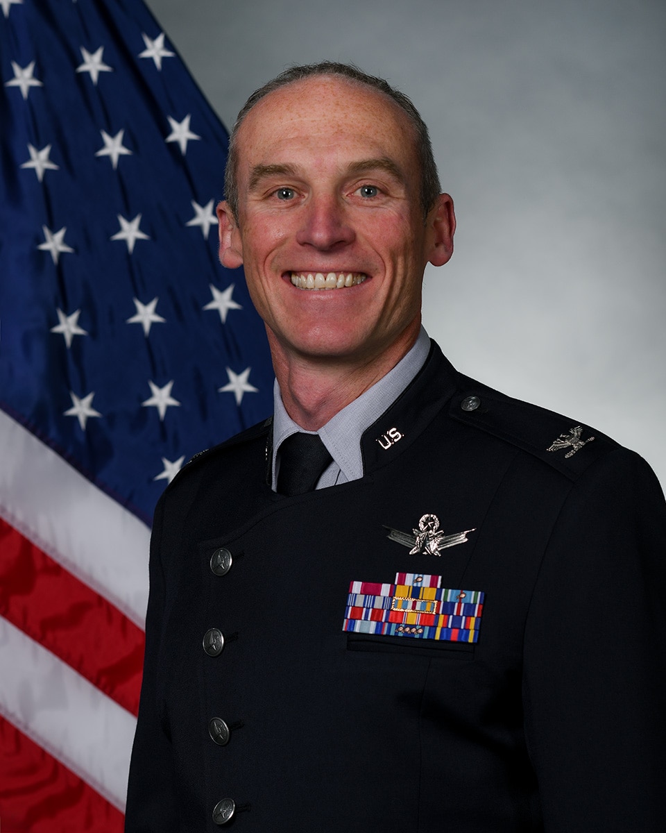 Col. Charles Cooper poses for official photo.