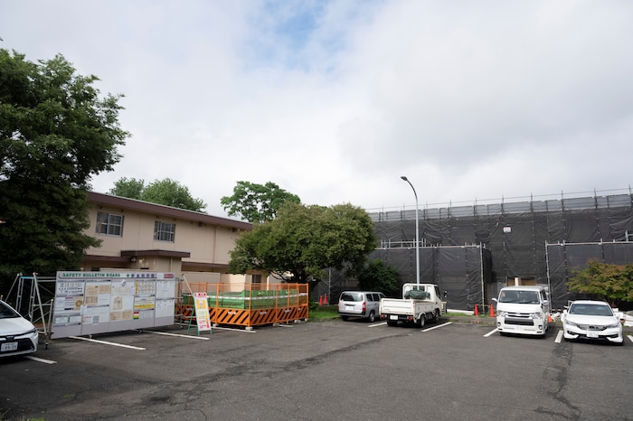 Construction materials surround military family housing units in the north housing section in Yokota Air Base, Japan, July 14, 2026.
