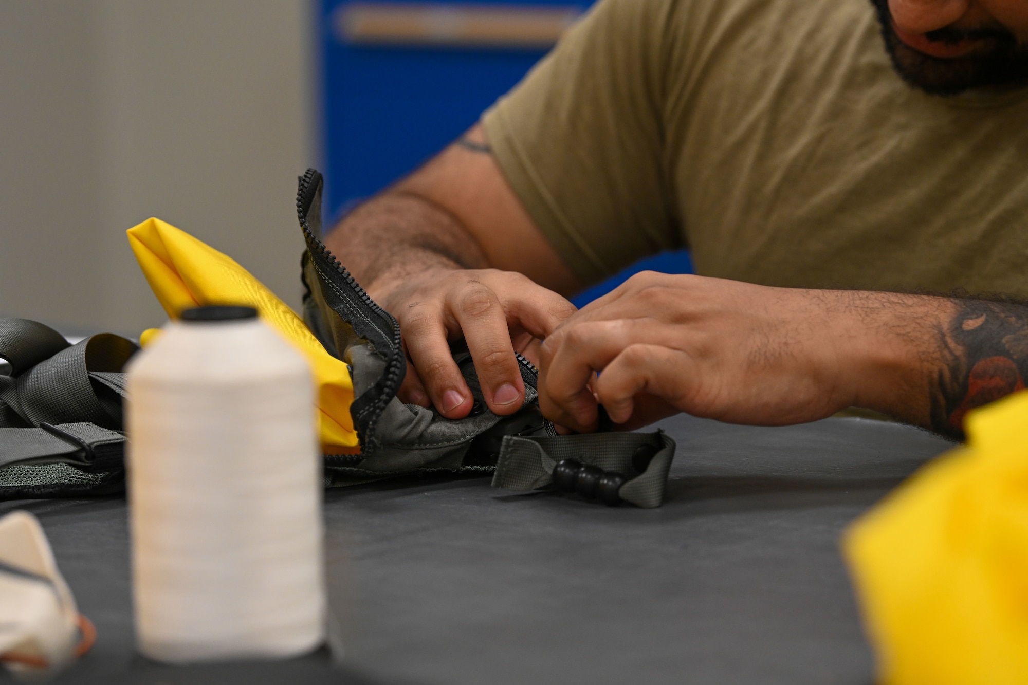 Airman working on aircrew flight equipment.