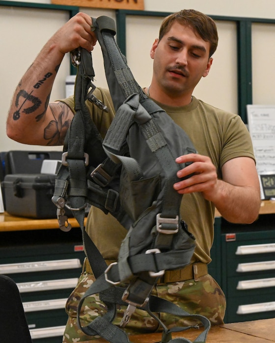 Airman working on aircrew flight equipment.