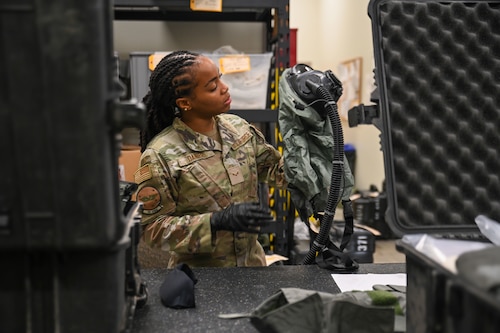 Airman working on aircrew flight equipment.