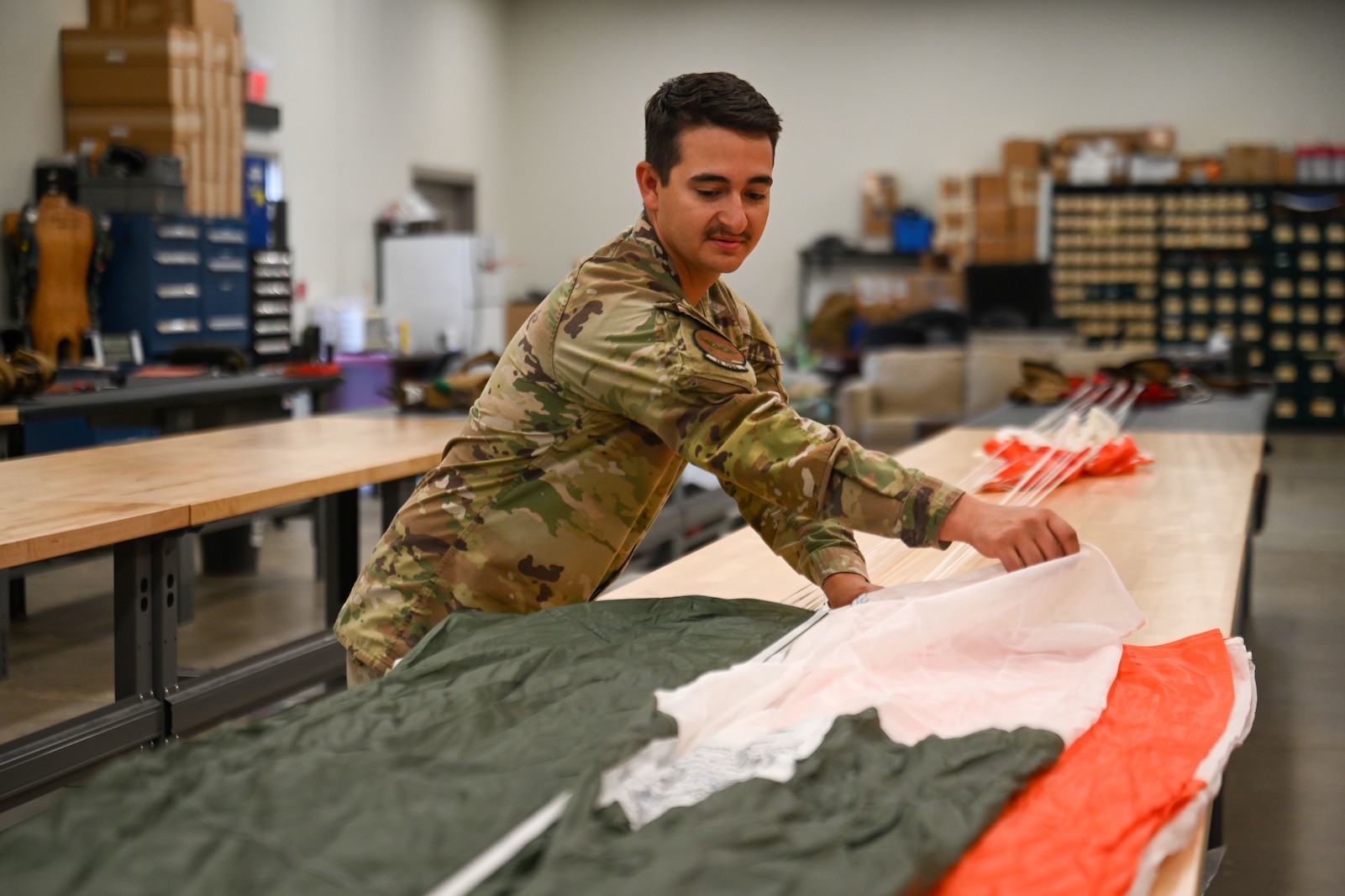 Airman working on aircrew flight equipment.