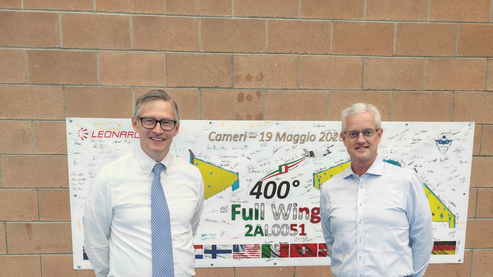 Navy Vice Adm. Stephen Tedford stands with Milan Consul General Douglass Benning.