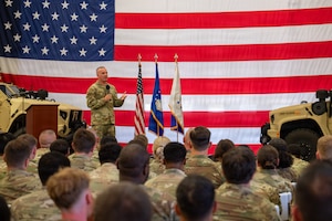 Photo of Chief Master Sergeant of the Air Force David R. Wolfe standing on a stage speaking to a crowd.