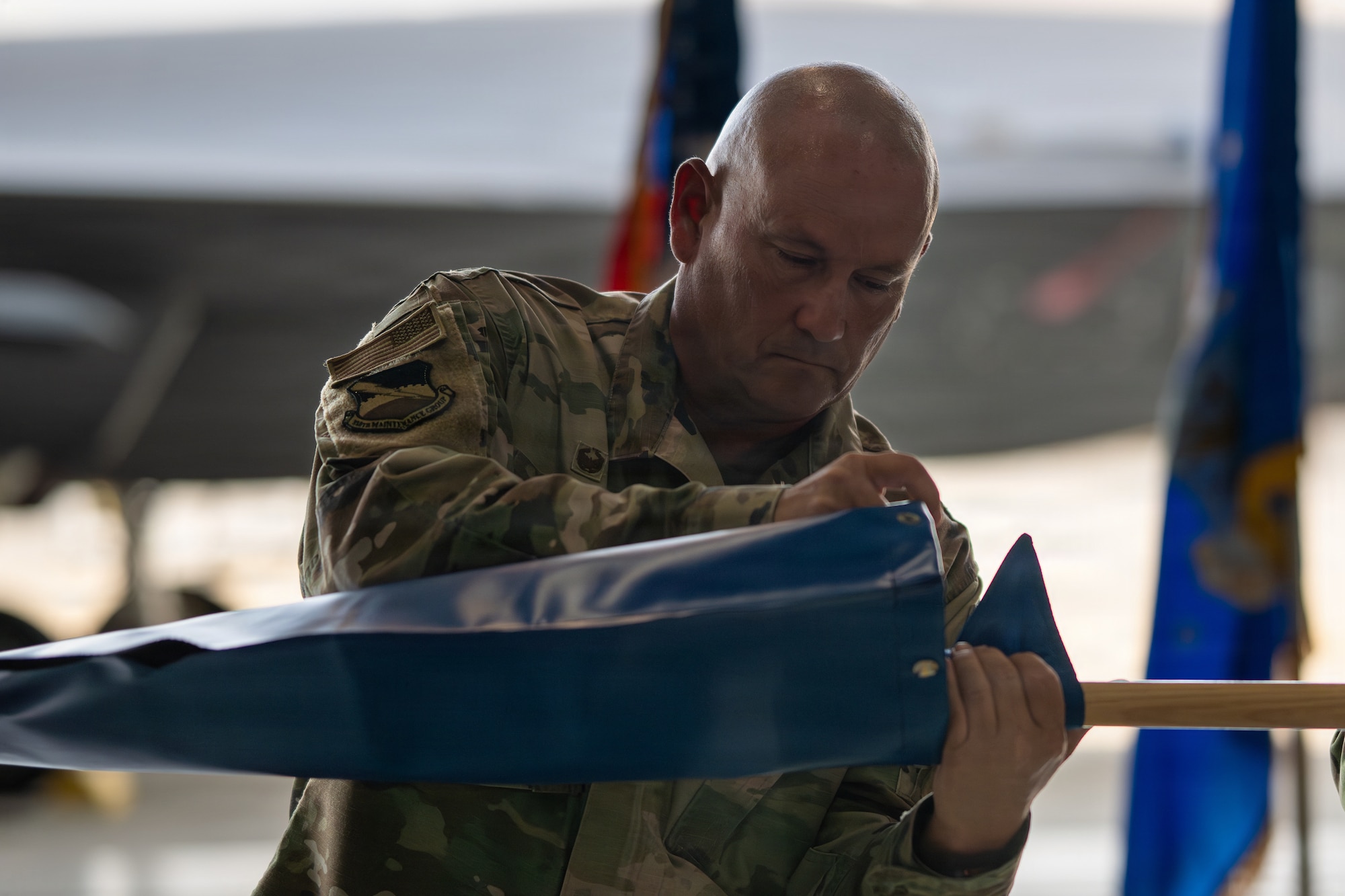 U.S. Air Force Col. Dennis Knight, 325th Maintenance Group commander, oversees the casing of the 95th Fighter Generation Squadron guidon during an inactivation ceremony at Tyndall Air Force Base, Florida, July 27, 2026.