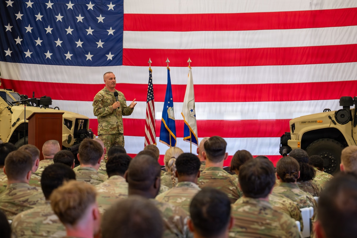 Photo of Chief Master Sergeant of the Air Force David R. Wolfe standing on a stage speaking to a crowd.