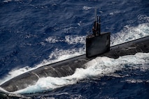 Los Angeles-class fast-attack submarine USS Charlotte (SSN 766) participates in a group sail July 22, 2026, in the Pacific Ocean off the coast of Hawaii during Exercise Rim of the Pacific 2026.
