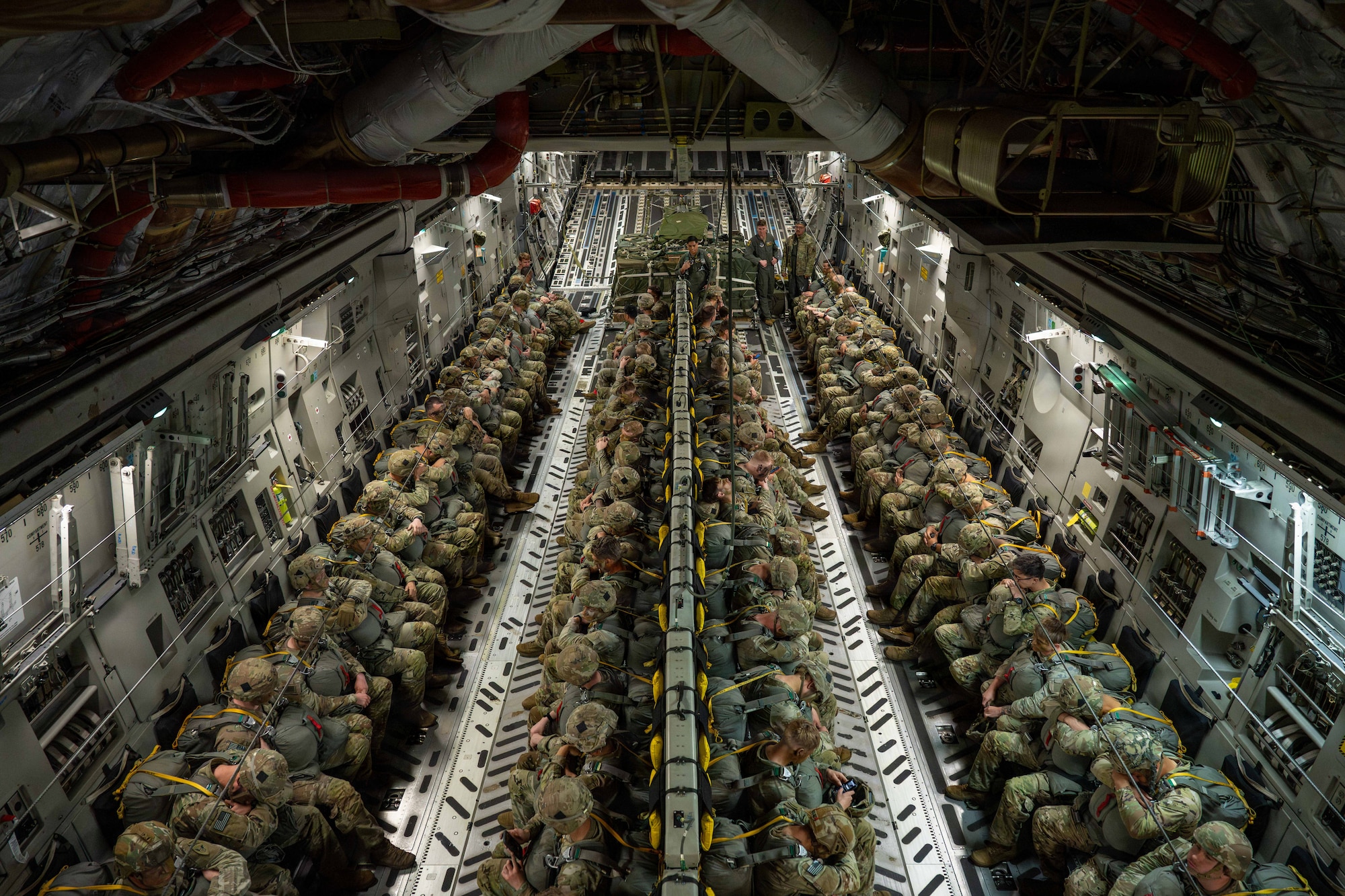 U.S. Soldiers assigned to the 1st Battalion, 501st Parachute Infantry Regiment, 11th Airborne
Division fly in a C-17 Globemaster III during Arctic Predictable Iron ‘26 at Joint Base Elmendorf-
Richardson, Alaska, July 17, 2026. The joint exercise integrated U.S. Air Force airlift capabilities
with U.S. Army airborne operations to enhance interoperability and combat readiness. (U.S. Air
Force photo by Senior Airman Lauren Torres)